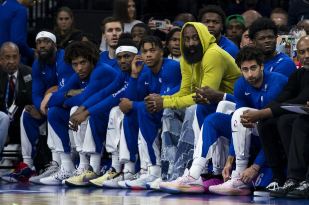 Philadelphia 76ers' James Harden, third from right, looks on from the bench with his teammates during the first half of an NBA basketball game against the Portland Trail Blazers, Sunday, Oct. 29, 2023, in Philadelphia. 