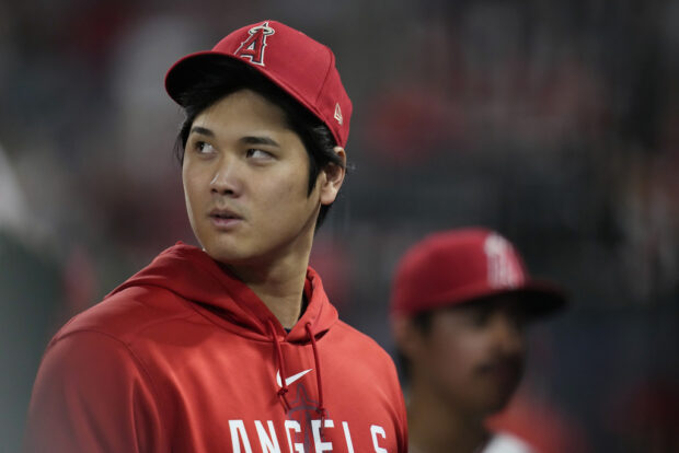 Los Angeles Angels' Shohei Ohtani walks in the dugout during the ninth inning of the team's baseball game against the Detroit Tigers in Anaheim.