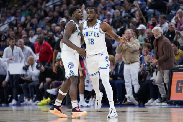 Minnesota Timberwolves guard Shake Milton (18) celebrates with guard Anthony Edwards (5) after making a basket during the first half of an NBA basketball game against the New Orleans Pelicans, Wednesday, Nov. 8, 2023, in Minneapolis.