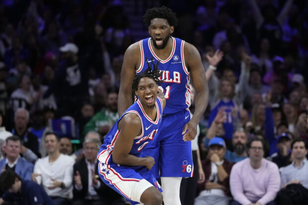 Philadelphia 76ers' Tyrese Maxey, left, and Joel Embiid react after a basket during the second half of an NBA basketball game against the Boston Celtics, Wednesday, Nov. 8, 2023, in Philadelphia.