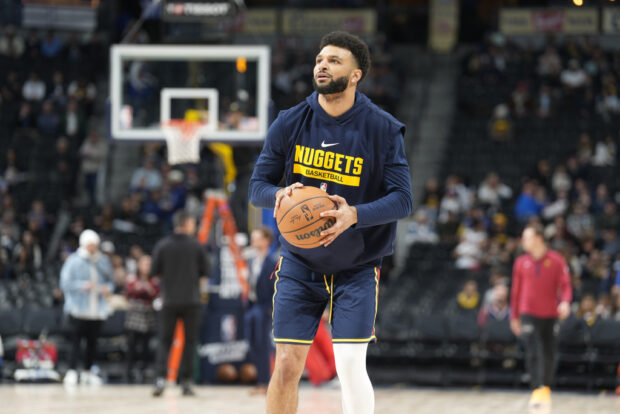 Sidelined by a hamstring injury, Denver Nuggets guard Jamal Murray (27) practices before the first half of an NBA basketball game Wednesday, Nov. 8, 2023, in Denver.