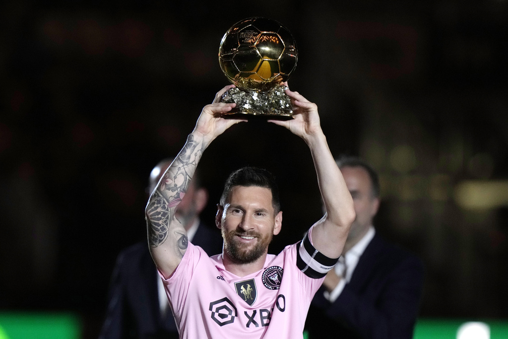 Inter Miami forward Lionel Messi holds his Ballon d'Or trophy before the team's club friendly soccer match against New York City FC, Friday, Nov. 10, 2023, in Fort Lauderdale, Florida.