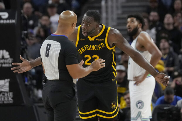 Golden State Warriors forward Draymond Green (23) reacts toward referee Marc Davis (8) during the second half of an NBA basketball game between the Warriors and the Minnesota Timberwolves in San Francisco, Sunday, Nov. 12, 2023. (