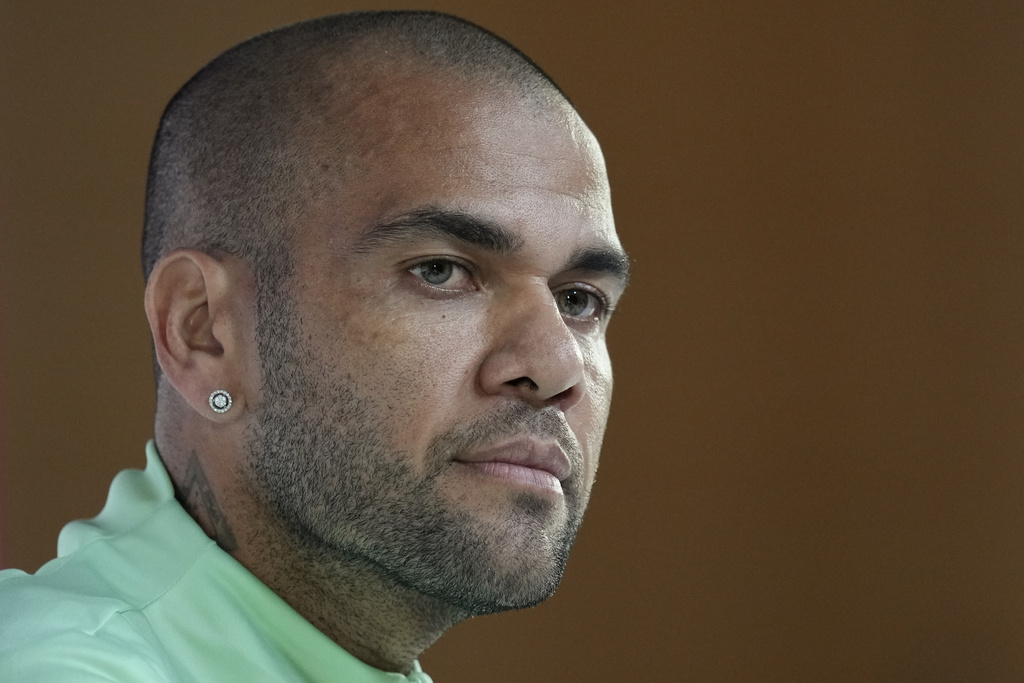 FILE - Brazil's Dani Alves listens to a question during a press conference on the eve of the group G of World Cup soccer match between Brazil and Cameroon in Doha, Qatar, on Dec. 1, 2022. 