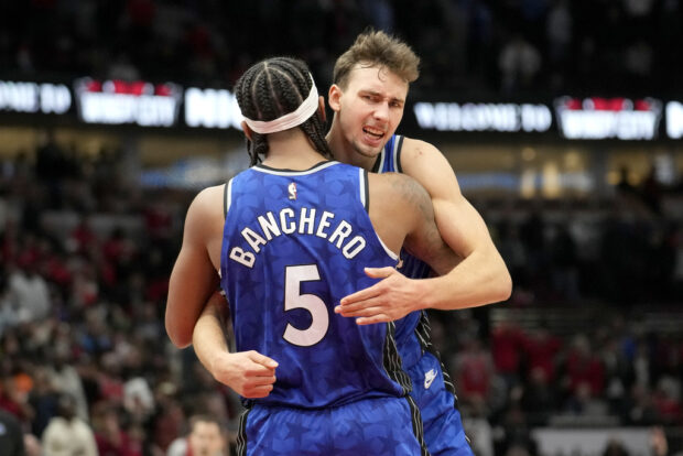 Orlando Magic's Franz Wagner hugs Paolo Banchero after the team's 96-94 win over the Chicago Bulls in an NBA basketball game Wednesday, Nov. 15, 2023, in Chicago.