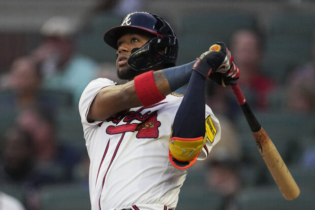 FILE - Atlanta Braves' Ronald Acuna Jr. watches his solo home run in the first inning of a baseball game against the Philadelphia Phillies Tuesday, Sept. 19, 2023. A