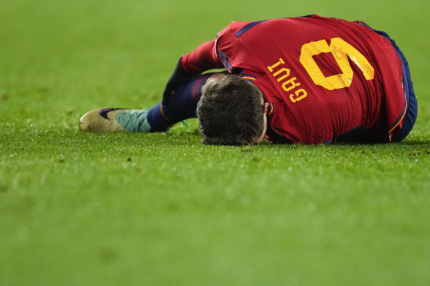 Spaniard Gavi Paez reacts after injuring his leg during the Euro 2024 Group A qualifying match between Spain and Georgia at the Jose Zorrilla Stadium in Valladolid, Spain, Sunday, November 19 and 23, 2023