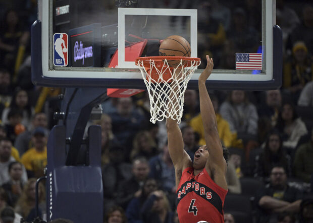 Toronto Raptors forward Scottie Barnes scores against the Indiana Pacers during the first half of an NBA basketball game Wednesday, Nov. 22, 2023, in Indianapolis