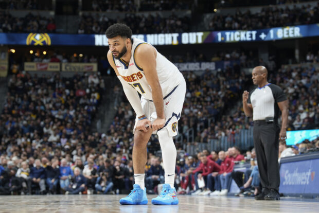 Denver Nuggets guard Jamal Murray looks on during a break in the action in the second half of an NBA basketball game against the Houston Rockets on Wednesday, Nov. 29, 2023, in Denver. Murray was playing in his first game since being sidelined with a leg injury.