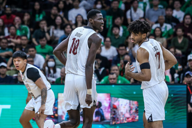 UP Fighting Maroons' Malick Diouf and Francis Lopez in the UAAP men's basketball Finals Game 1. 