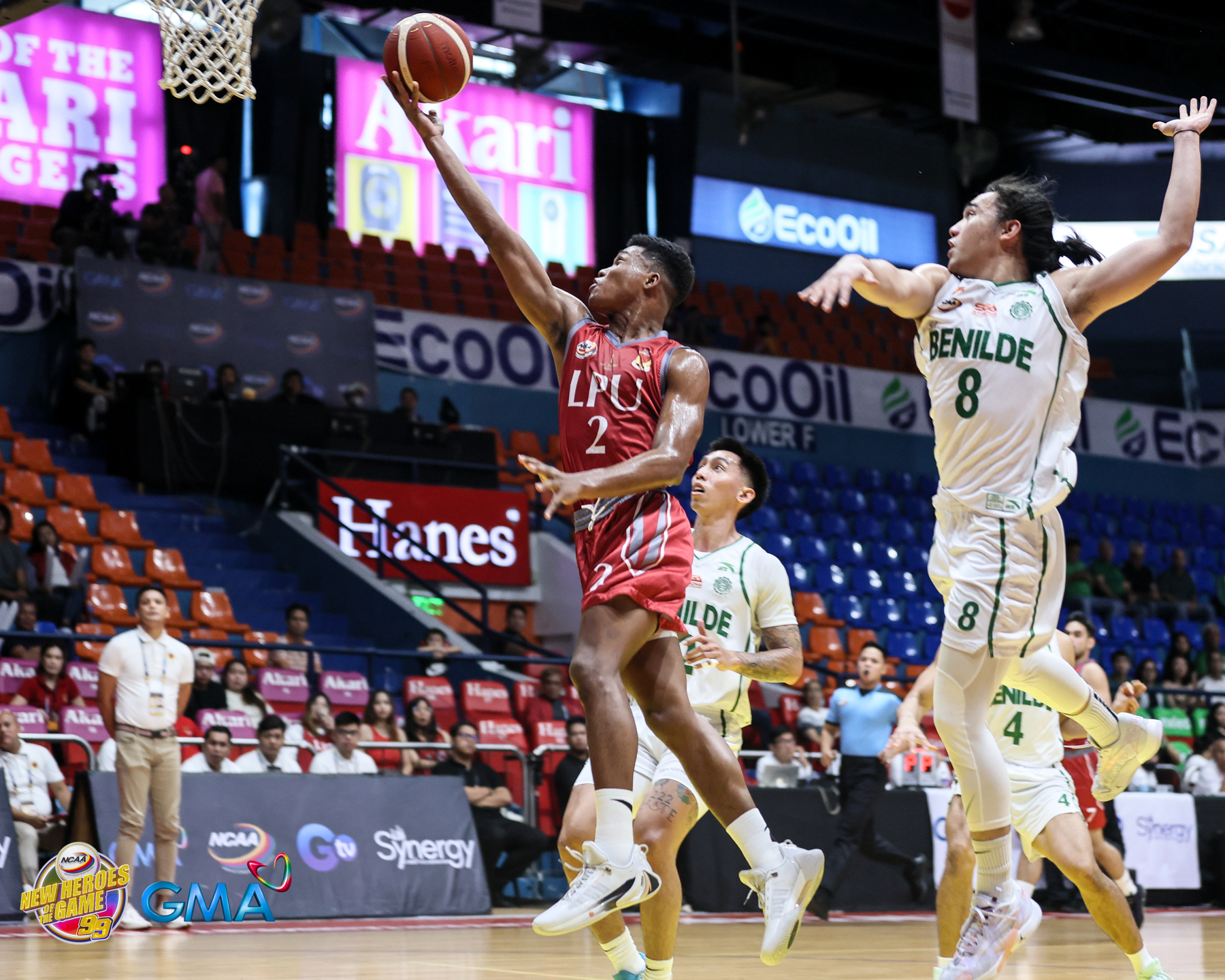 Lyceum's Enoch Valdez flies past College of St. Benilde's Migs Oczon and Miggy Corteza for the layup. –NCAA Photo