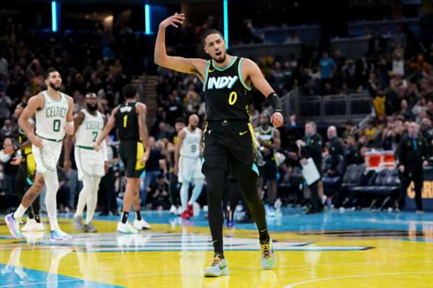 Tyrese Haliburton #0 of the Indiana Pacers interacts with the crowd in the third quarter against the Boston Celtics during the NBA In-Season Tournament at Gainbridge Fieldhouse on December 04, 2023 in Indianapolis, Indiana. 