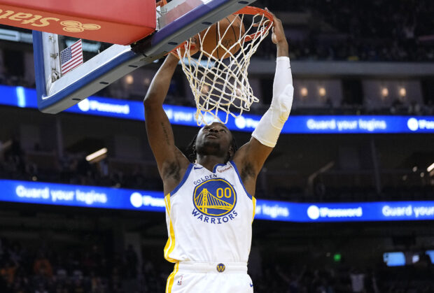 Jonathan Kuminga #00 of the Golden State Warriors dunks against the Portland Trail Blazers during the third quarter at Chase Center on December 06, 2023 in San Francisco, California. 