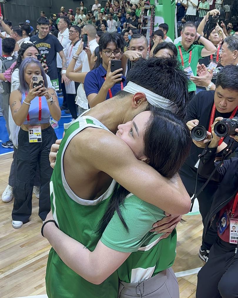 Newly minted UAAP champion Evan Nelle and Kitty Duterte share a hug after La Salle wins Season 86 championship.