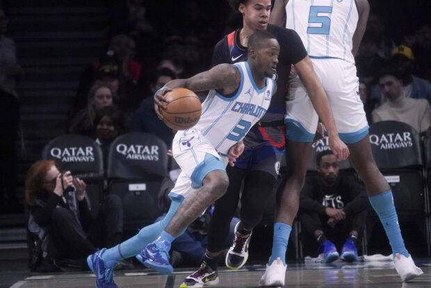 Charlotte Hornets' Terry Rozier dribbles to the basket during an NBA basketball game against the Brooklyn Nets, Thursday, Nov. 30, 2023, in New York.