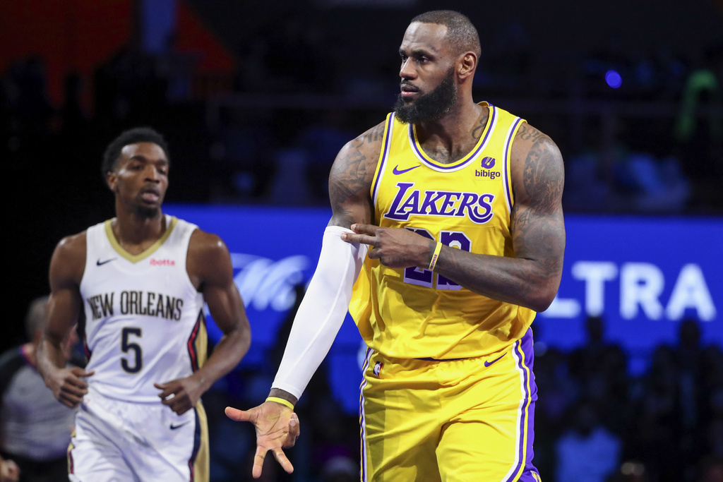 Los Angeles Lakers forward LeBron James (23) celebrates after making a 3-point basket against the New Orleans Pelicans during the first half of a semifinal in the NBA basketball In-Season Tournament, Thursday, Dec. 7, 2023, in Las Vegas.