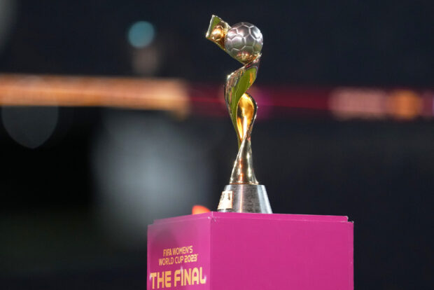 FILE - The tournament trophy is displayed on the pitch before the Women's World Cup soccer final between Spain and England at Stadium Australia in Sydney, Australia, on Aug. 20, 2023