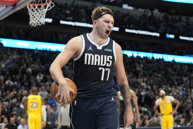 Dallas Mavericks guard Luka Doncic reacts to a call during the second half of an NBA basketball game against the Los Angeles Lakers in Dallas, Tuesday, Dec. 12, 2023.