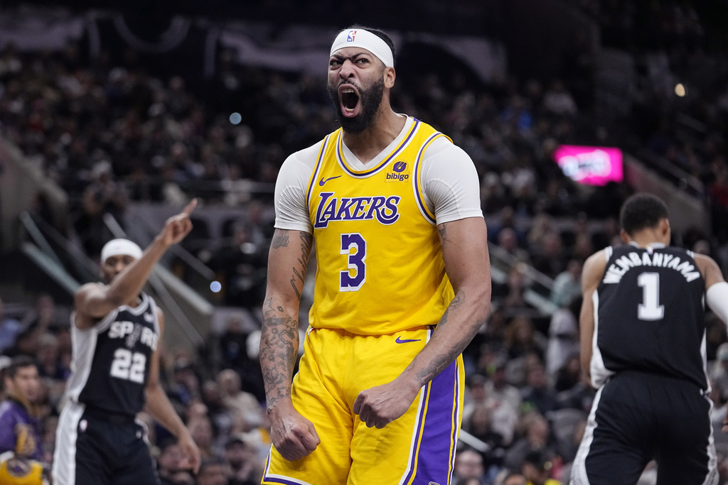 Los Angeles Lakers forward Anthony Davis (3) reacts after scoring over San Antonio Spurs center Victor Wembanyama (1) during the first half of an NBA basketball game in San Antonio, Wednesday, Dec. 13, 2023.