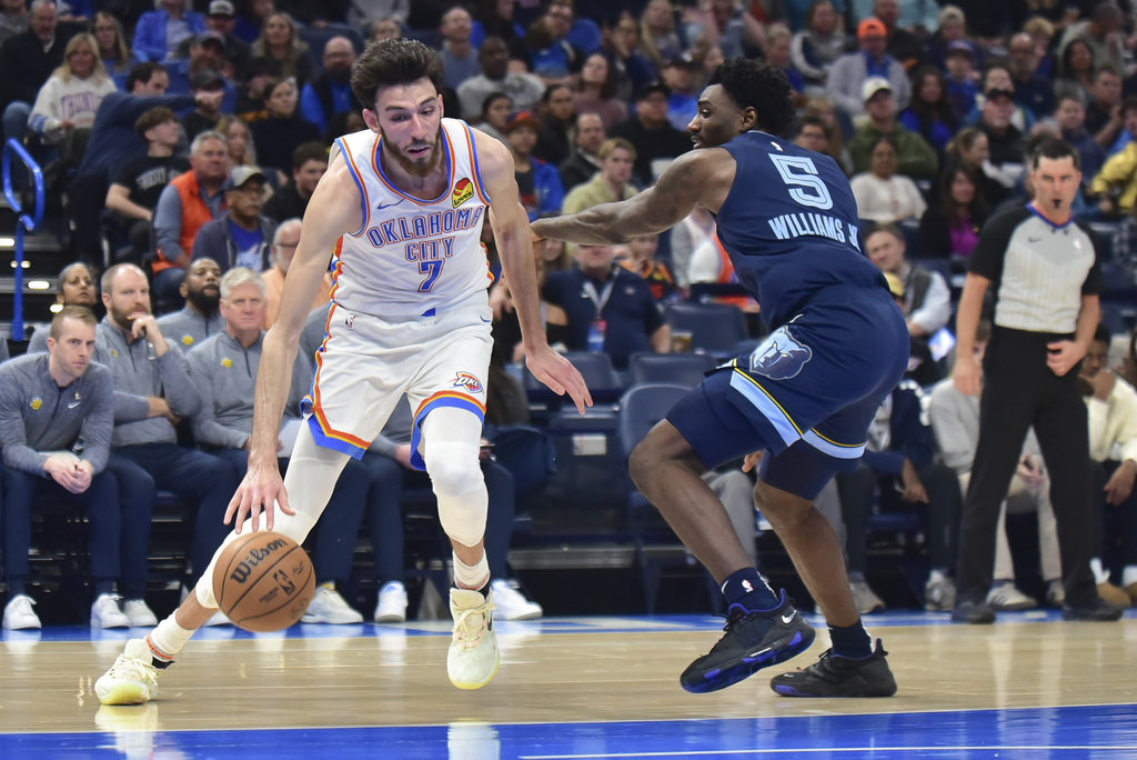 Oklahoma City Thunder forward Chet Holmgren (7) pushes past Memphis Grizzlies guard Vince Williams Jr. (5) in the first half of an NBA basketball game, Monday, Dec. 18, 2023, in Oklahoma City. 