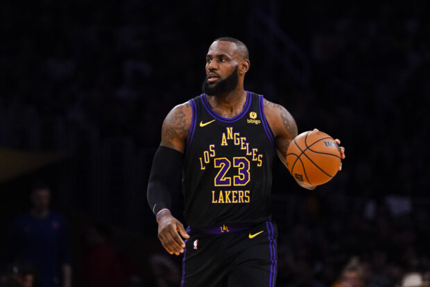 Los Angeles Lakers forward LeBron James dribbles during the first half of an NBA basketball game against the New York Knicks, Monday, Dec. 18, 2023, in Los Angeles.