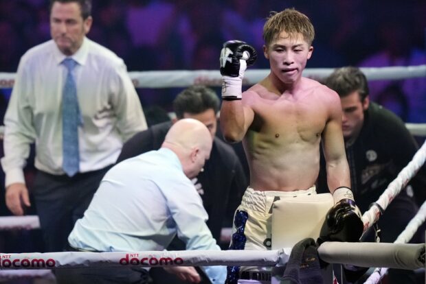 Naoya Inoue of Japan celebrates after beating Marlon Tapales of the Philippines in the tenth round of a boxing match for the unified WBA, WBC, WBO and IBF super bantamweight world titles in Tokyo, Tuesday, Dec. 26, 2023.