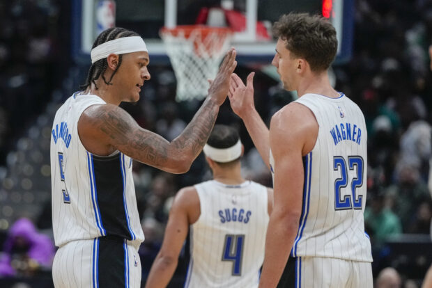 Orlando Magic forwards Paolo Banchero and Franz Wagner (22) celebrate after a play during the second half of an NBA basketball game against the Washington Wizards, Tuesday, Dec. 26, 2023, in Washington. 