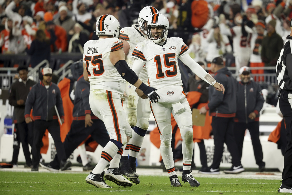 Cleveland Browns quarterback Joe Flacco (15) celebrates with guard Joel Bitonio (75) after throwing a pass for a touchdown during an NFL football game against the New York Jets, Thursday, Dec. 28, 2023, in Cleveland.