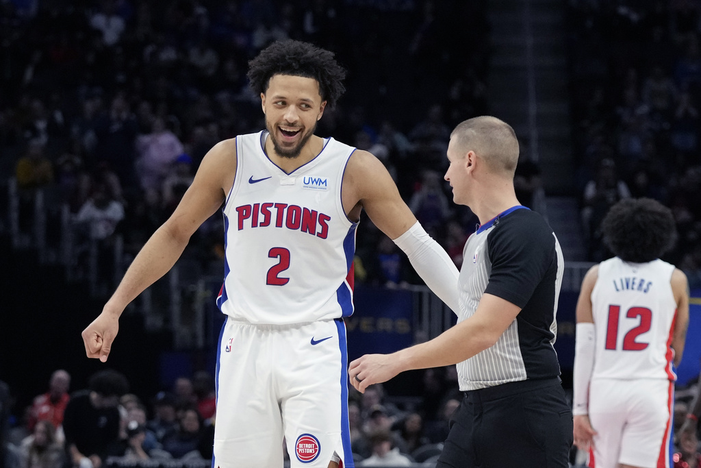 Detroit Pistons guard Cade Cunningham (2) talks with referee Tyler Ford during the second half of an NBA basketball game against the Toronto Raptors, Saturday, Dec. 30, 2023, in Detroit.