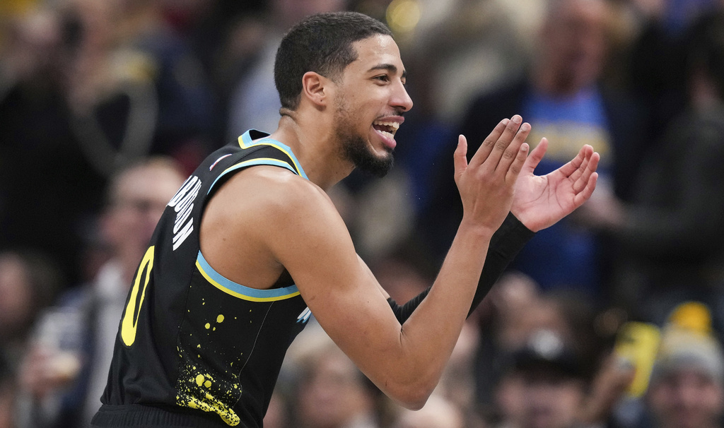 Indiana Pacers guard Tyrese Haliburton applauds during the team's NBA basketball game against the New York Knicks on Saturday, Dec. 30, 2023, in Indianapolis.
