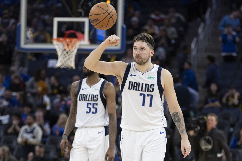 Dallas Mavericks guard Luka Doncic (77) reacts after the team's win over the Golden State Warriors in an NBA basketball game in San Francisco, Saturday, Dec. 30, 2023. 
