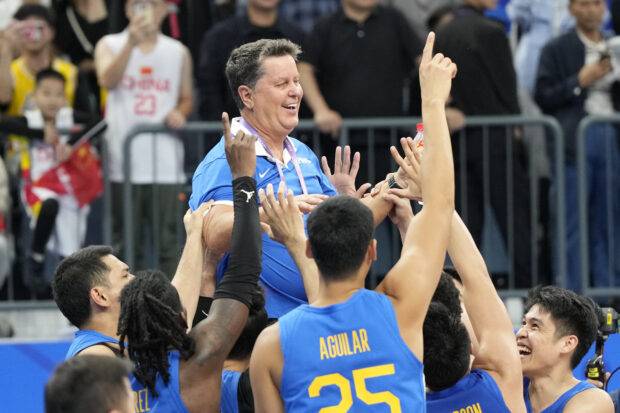 Tim Cone in his Asian Games victory ride. —PDI FILES