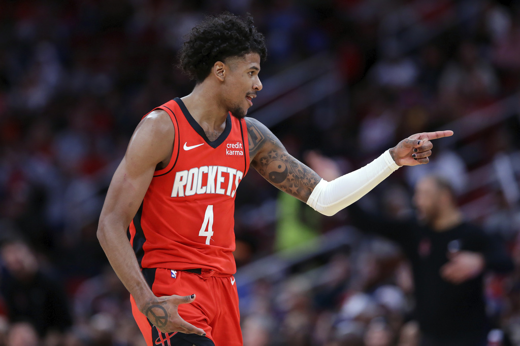 Houston Rockets guard Jalen Green points at the Detroit Pistons bench after sinking a three-point shot during the second half of an NBA basketball game Monday, Jan. 1, 2024, in Houston