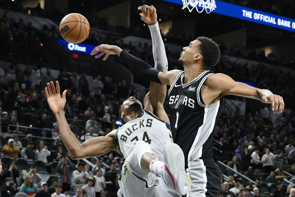 San Antonio Spurs' Victor Wembanyama (1) blocks a shot by Milwaukee Bucks' Giannis Antetokounmpo during the second half of an NBA basketball game Thursday, Jan. 4, 2024, in San Antonio.