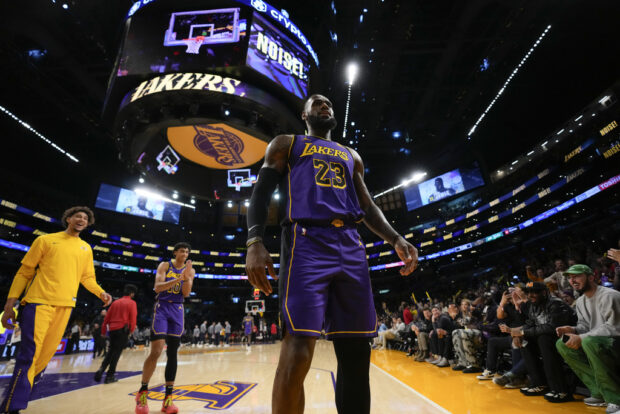 Los Angeles Lakers forward LeBron James (23) celebrates after scoring a 3-pointer during the first half of an NBA basketball game against the Memphis Grizzlies in Los Angeles, Friday, Jan. 5, 2024. (