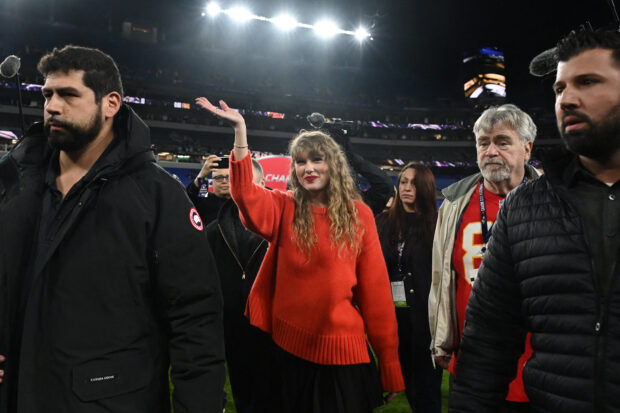 American singer-songwriter Taylor Swift walks off the field after the Kansas City Chiefs won the AFC Championship football game 