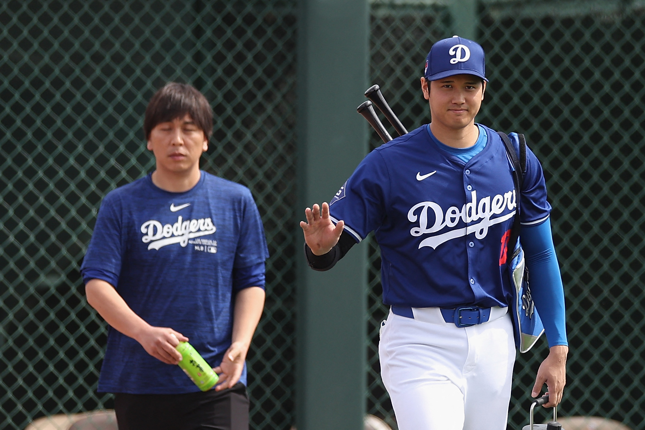 Shohei Ohtani #17 of the Los Angeles Dodgers and interpreter Ippei Mizuhara