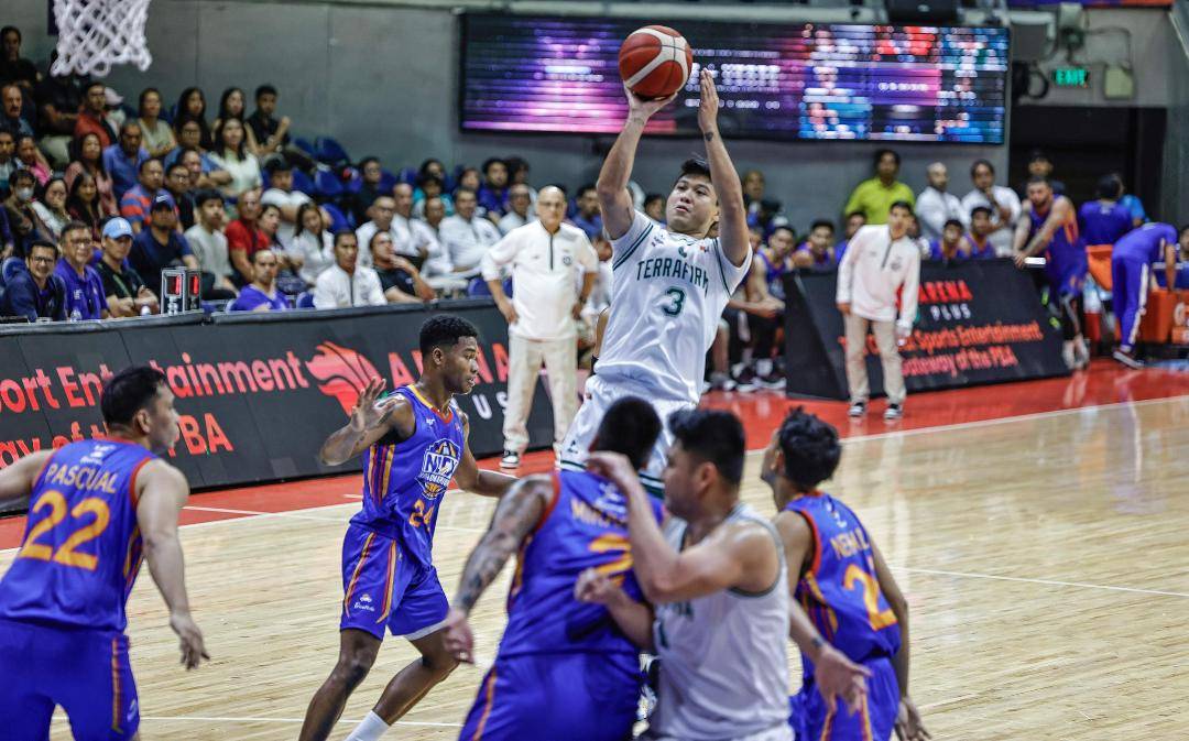 Juami Tiongson (No. 3) still gets away with a teamhigh 21 points despite 5-for- 17 shooting for Terrafirma. —PBA PHOTO