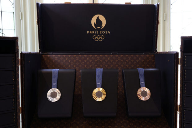 Displays show Olympics gold, silver and bronze medals in a Louis Vuitton Medals Trunk