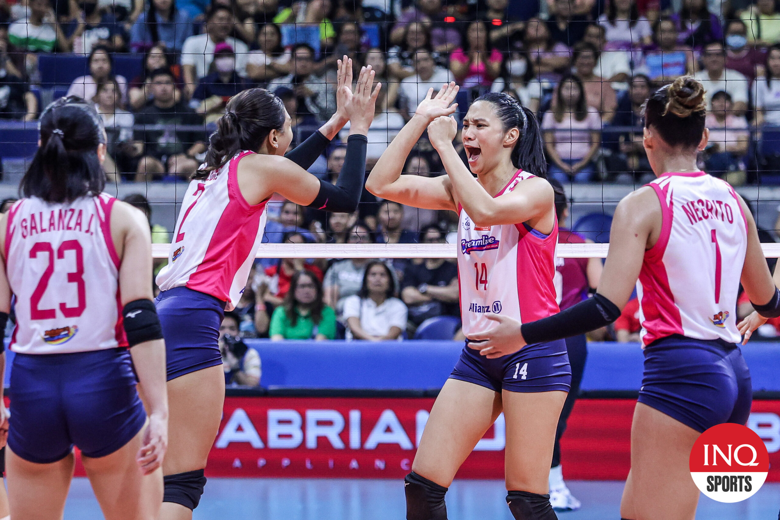 Creamlline Cool Smashers' Bea De Leon (right) and Alyssa Valdez share a high five after a point.