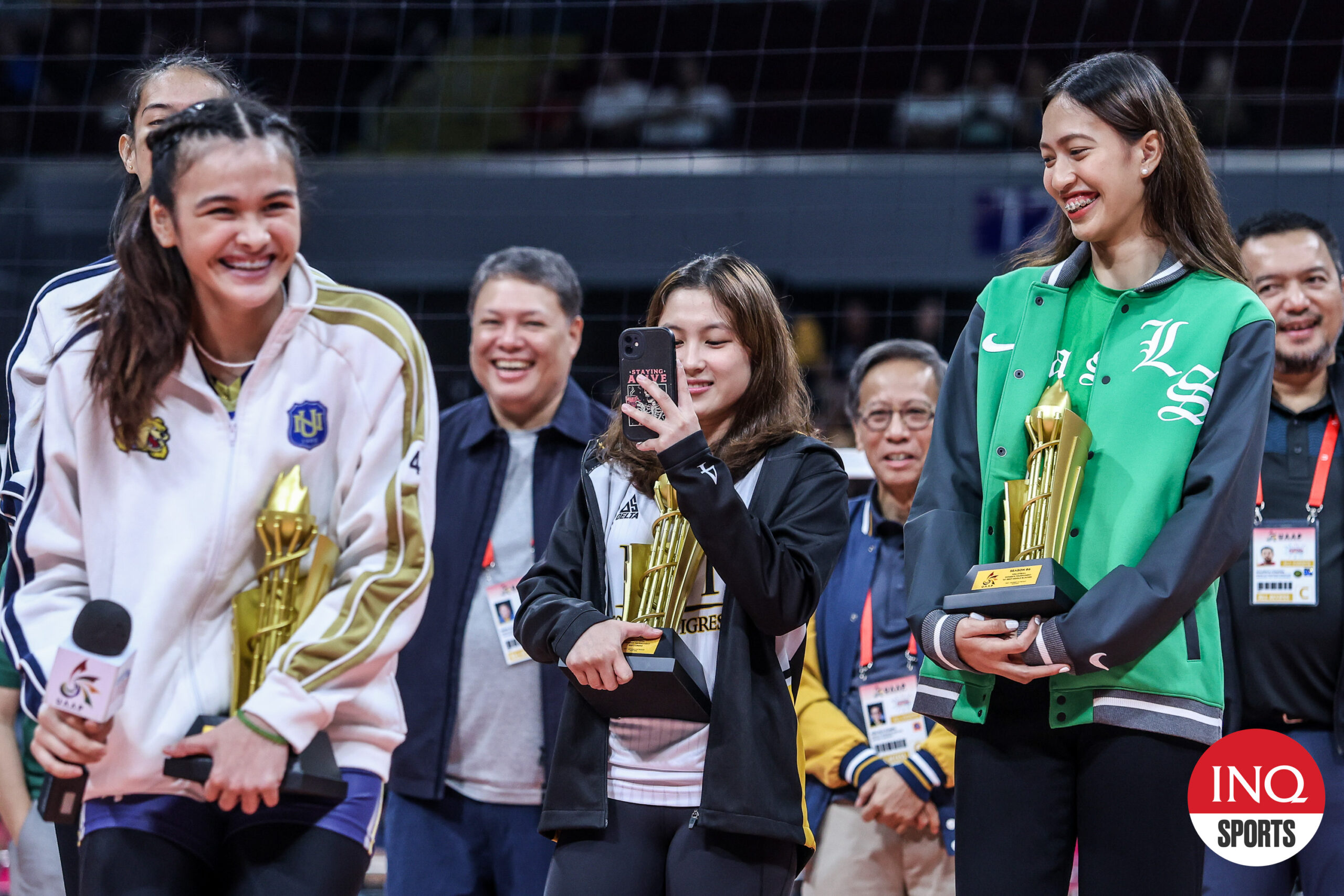 Detdet Pepito takes a video of Bella Belen during the UAAP Season 86 volleyball awarding ceremony