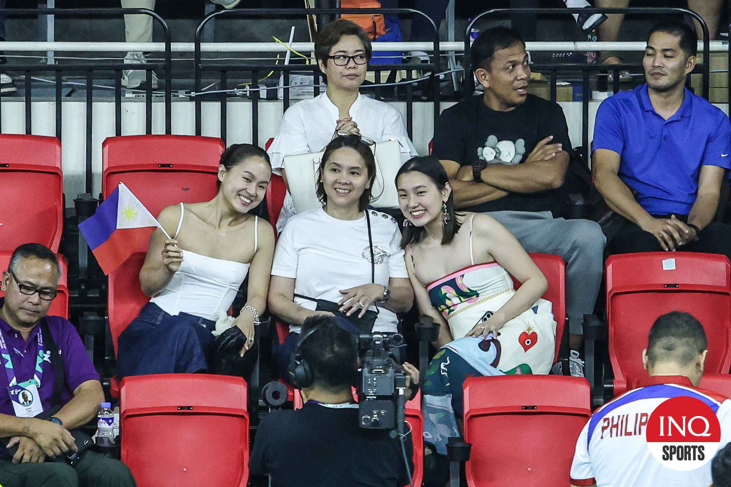 Filipino-Ivorian Maxine Esteban (left) pulls up to watch the Alas Pilipinas game in the AVC Challenge Cup.