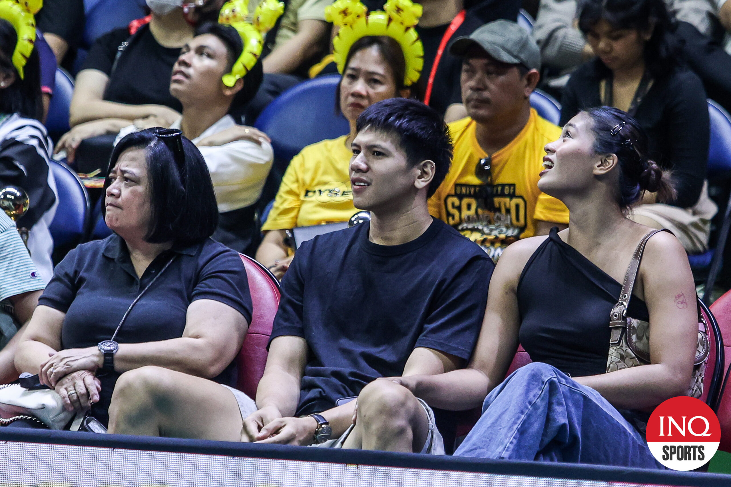 Former UST Golden Spikers' star Jau Umandal watching the UAAP men's volleyball Finals game between NU and UST.