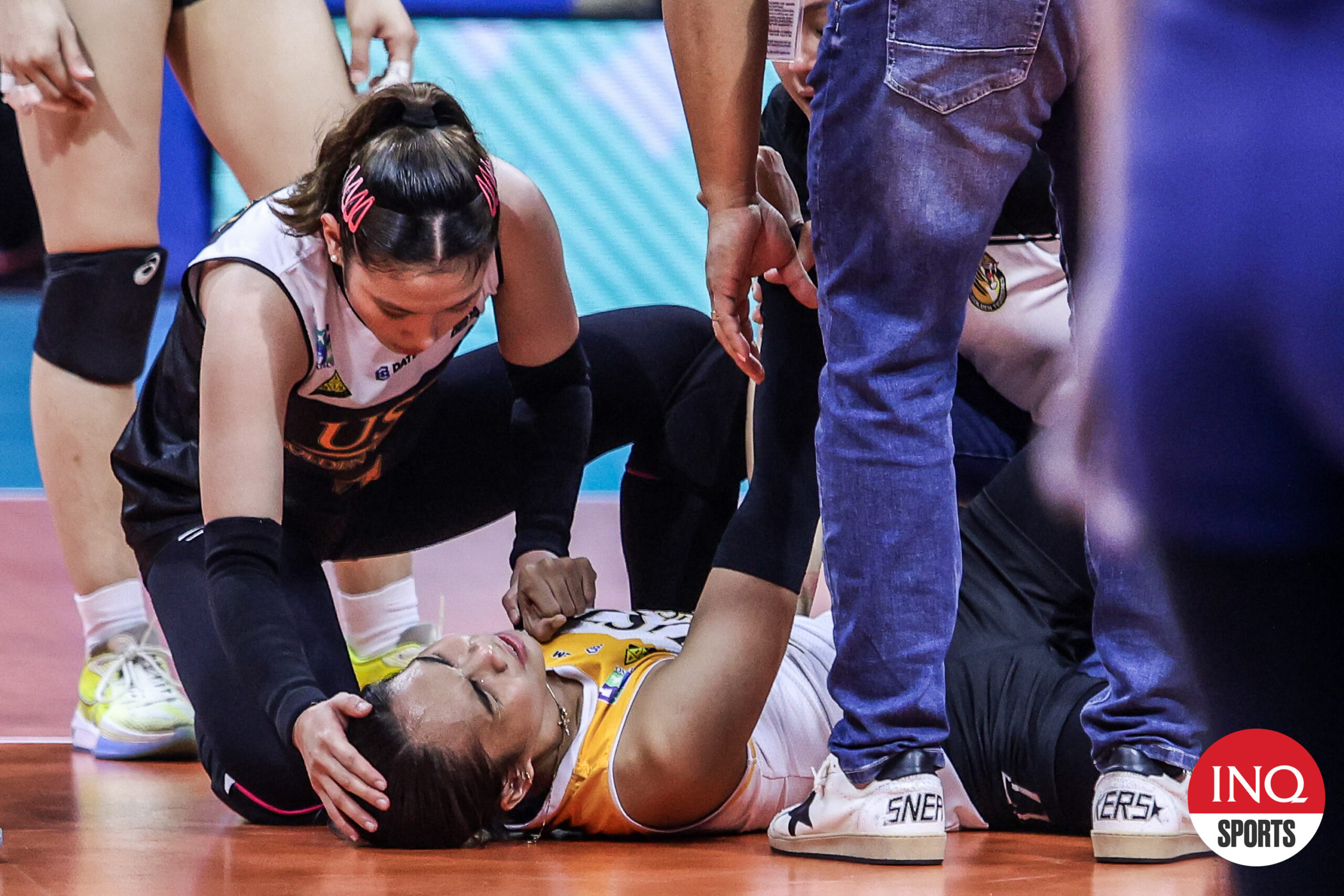 UST Tigresses' rookie Angge Poyos suffers an injury in Game 1 of the UAAP Season 86 women's volleyball finals