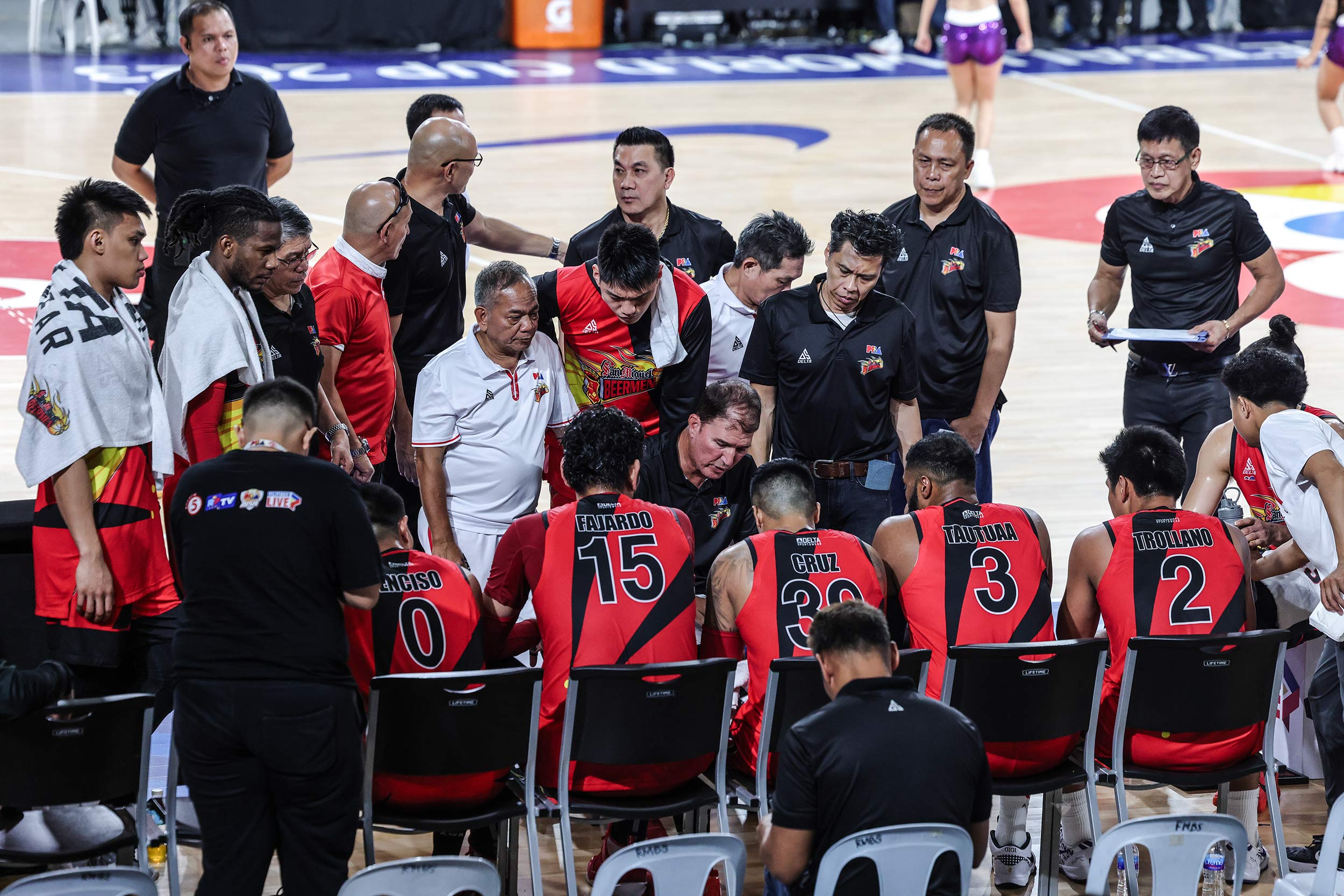 Coach Jorge Gallent during a huddle with the San Miguel Beermen in the PBA Philippine Cup quarterfinals against Terrafirma Dyip