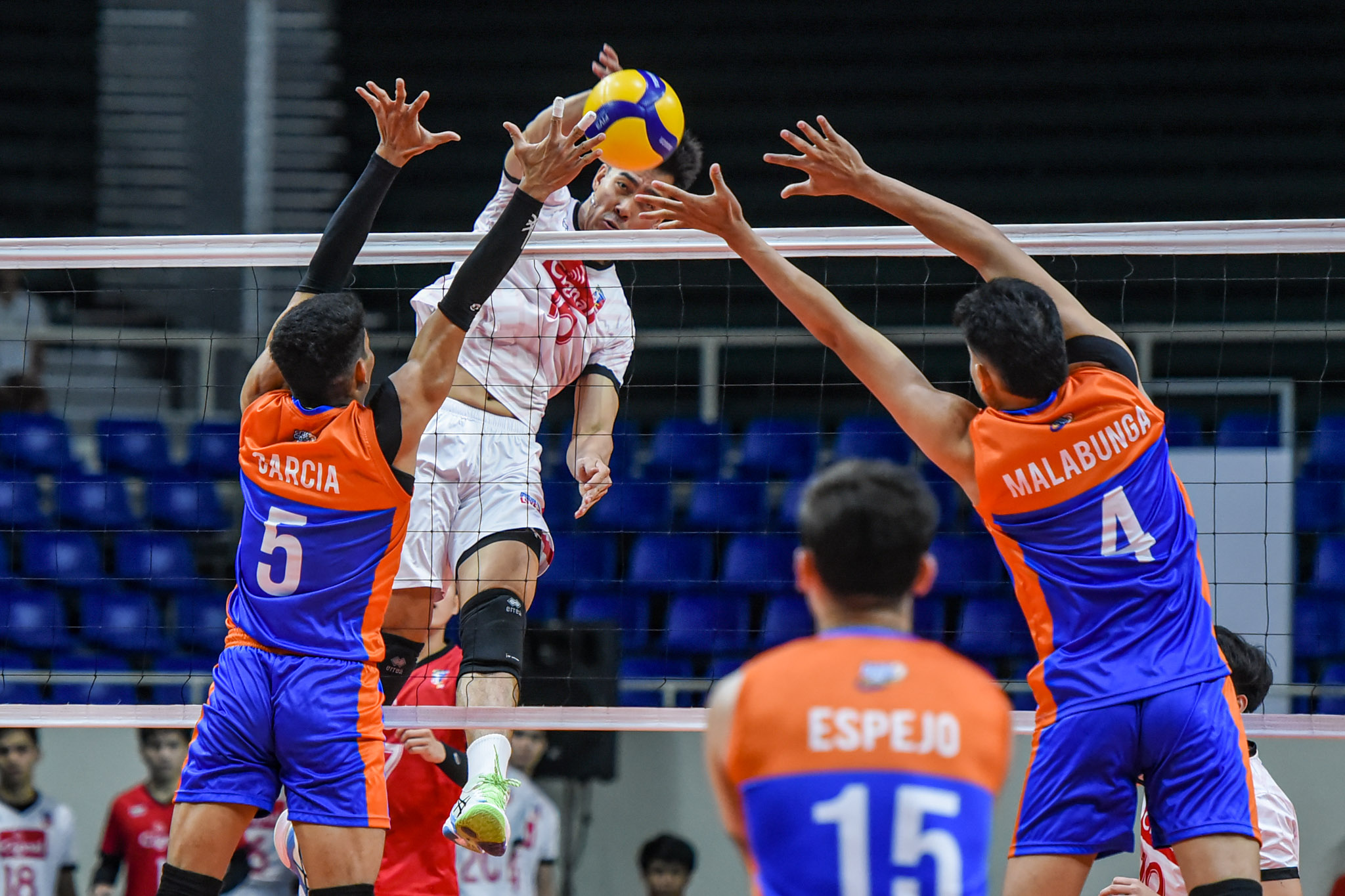 Cignal's Bryan Bagunas rises for a hit against Criss Cross defenders in the Spikers Turf Open Conference Finals