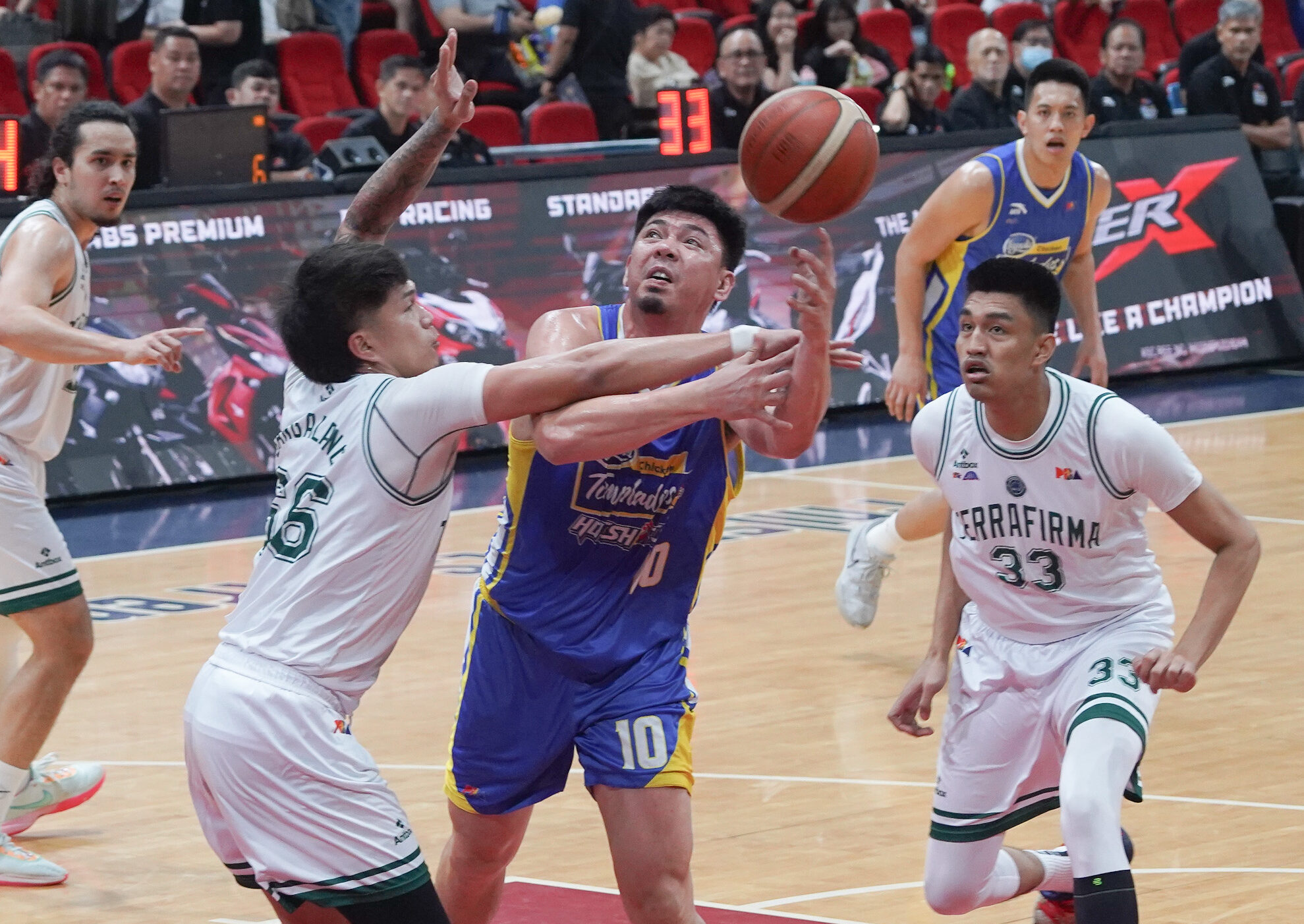 Ian Sangalang (right) gets a hard foul from Louie Sangalang.