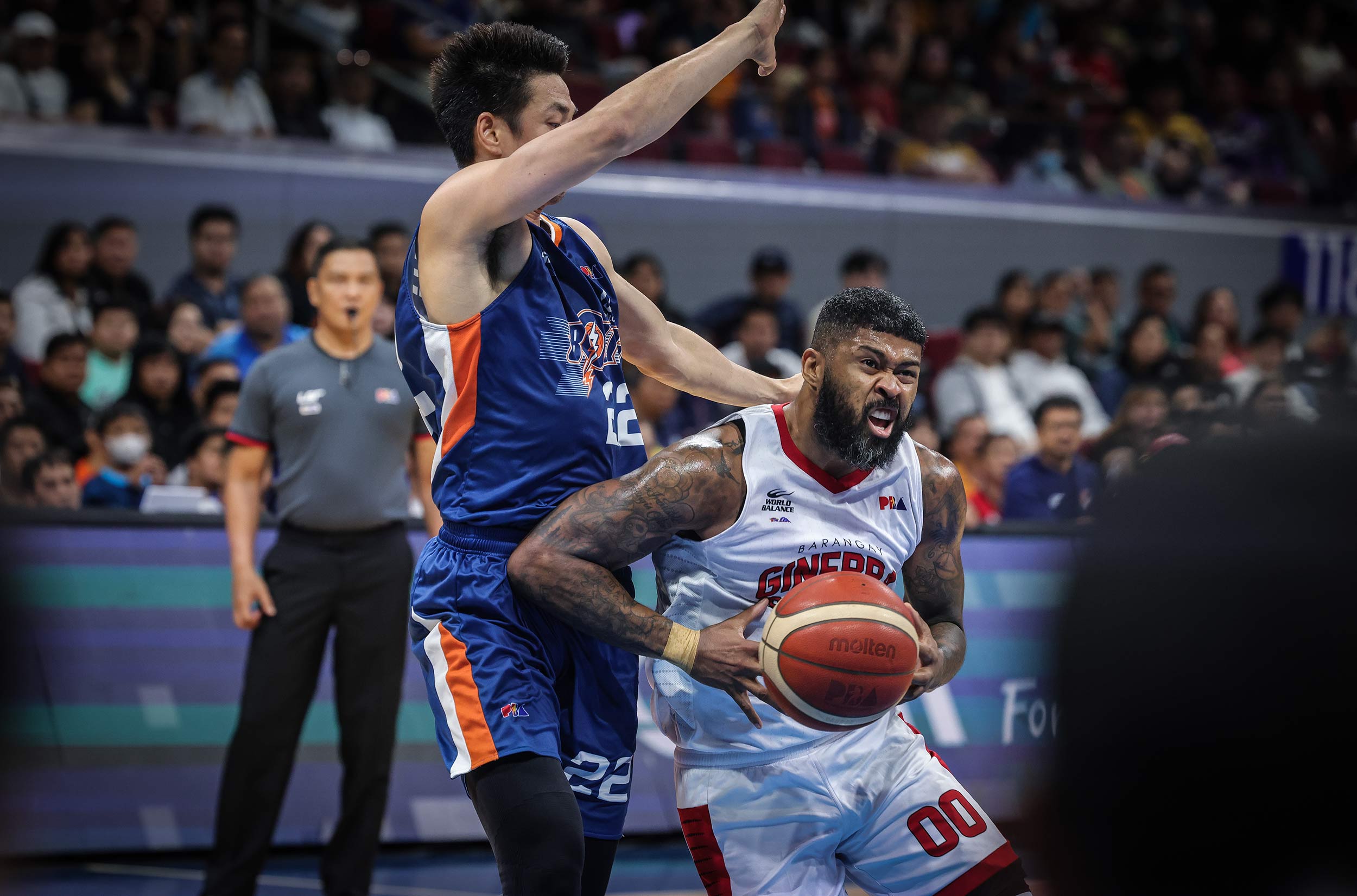 Ginebra Gin Kings' Maverick Ahanmisi against Meralco Bolts' Allein Maliksi in the PBA Philippine Cup semifinals.