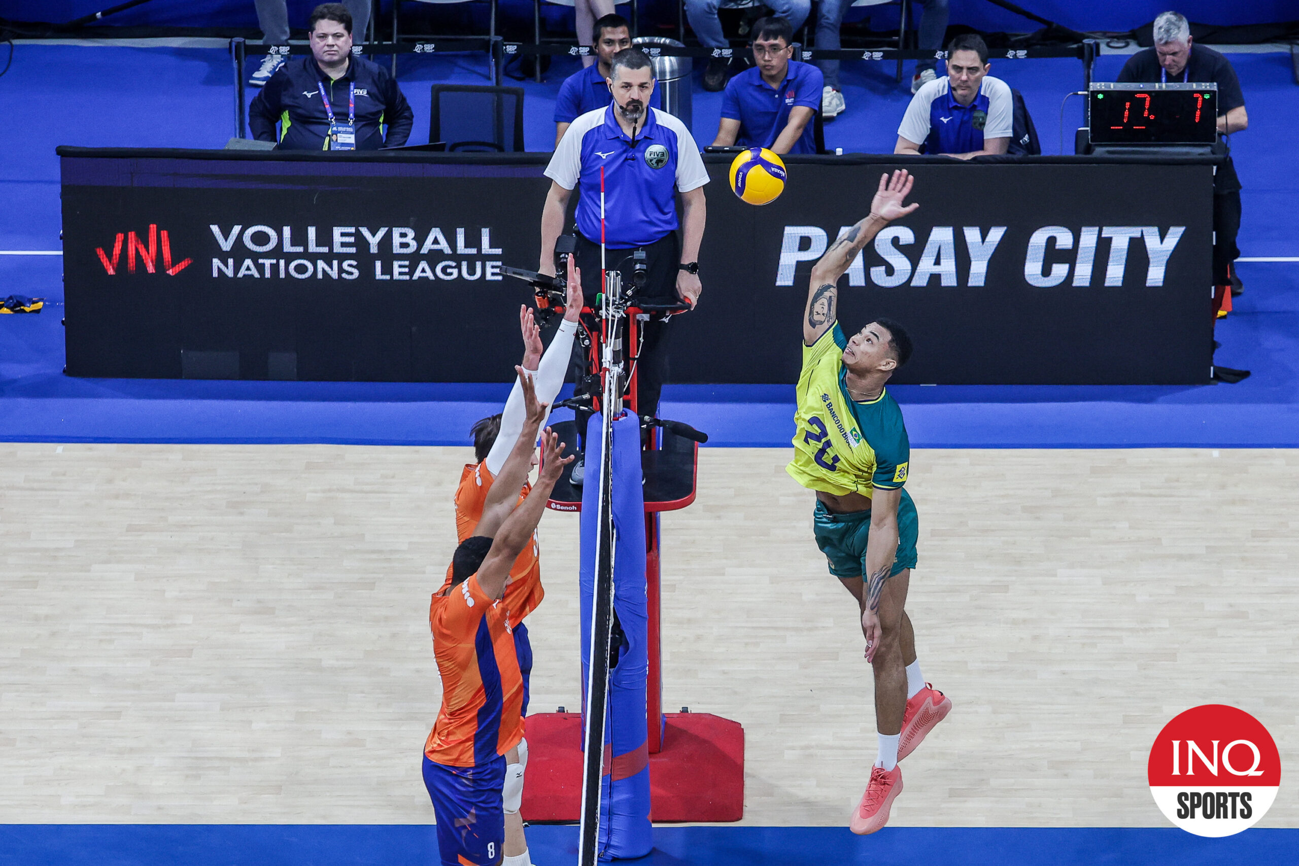 Brazil's Darlan Ferreira Souza goes for a hit against the Netherlands defenders in a VNL 2024 Week 3 game at Mall of Asia Arena.