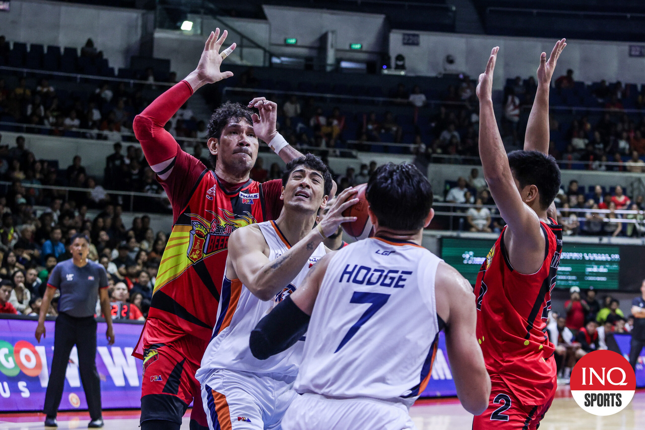 Meralco Bolts' Brandon Bates against San Miguel defenders in the PBA Philippine Cup Finals.